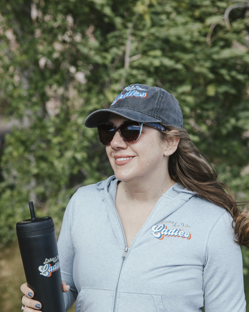 Leah Martin, founder of Living La Vita Ladies, in an LLVL cap and hoodie